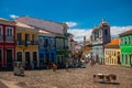 Historic city center of Pelourinho features brightly lit skyline of colonial architecture on a broad cobblestone hill in Salvador Royalty Free Stock Photo