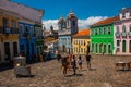 Historic city center of Pelourinho features brightly lit skyline of colonial architecture on a broad cobblestone hill in Salvador Royalty Free Stock Photo