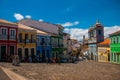 Historic city center of Pelourinho features brightly lit skyline of colonial architecture on a broad cobblestone hill in Salvador Royalty Free Stock Photo