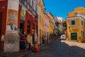Historic city center of Pelourinho features brightly lit skyline of colonial architecture on a broad cobblestone hill in Salvador Royalty Free Stock Photo
