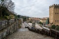 Historic city district with stone wall, stairs and a tower