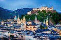 Historic city of Salzburg with Hohensalzburg Fortress at dusk, S