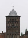 Historic clinker brick gate tower in LÃ¼beck Germany Royalty Free Stock Photo