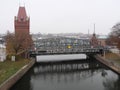 Historic clinker brick tower and iron bridge in LÃ¼beck Germany Royalty Free Stock Photo