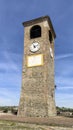 Historic Clock Tower in the Roma Square of the Ancient Village of Castelvetro of Modena, Italy.