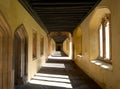 Cloisters, also known as the Great Quad, at Magdalen College, University of Oxford UK. Sunlight pours in through arched windows. Royalty Free Stock Photo
