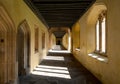 Cloisters, also known as the Great Quad, at Magdalen College, University of Oxford UK. Sunlight pours in through arched windows. Royalty Free Stock Photo