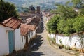 View downhill to a typical historic cobblestone street to Cathedral of the immaculate conception from, Barichara, Colombia Royalty Free Stock Photo