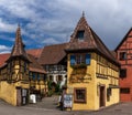 Historic colorful half-timbered houses and wine cellars in the village center of Eguisheim Royalty Free Stock Photo