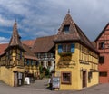 Historic colorful half-timbered houses and wine cellars in the village center of Eguisheim Royalty Free Stock Photo