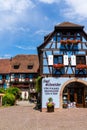 Historic colorful half-timbered houses and wine cellars in the village center of Eguisheim Royalty Free Stock Photo