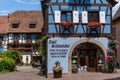 Historic colorful half-timbered houses and wine cellars in the village center of Eguisheim Royalty Free Stock Photo