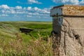 The historic concrete bridge in Scotsguard, SK with a wooden railway tressle in the background Royalty Free Stock Photo