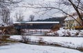 historic covered bridge crosses a river Royalty Free Stock Photo