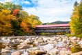 Historic covered bridge in New England in a partly cloudy autumn day Royalty Free Stock Photo