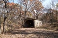 Historic covered wooden bridge in autumn woodland Royalty Free Stock Photo