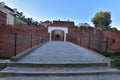 The historic defensive walls of the Warsaw Barbican and burgher houses in the Old Town in the light of the rising sun