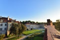The historic defensive walls of the Warsaw Barbican and burgher houses in the Old Town in the light of the rising sun