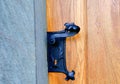 Historic door handle. Wrought black door handle Royalty Free Stock Photo