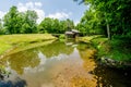 Historic Edwin B. Mabry Grist Mill (Mabry Mill) in rural Virginia on Blue Ridge Parkway and reflection on pond in summer Royalty Free Stock Photo