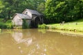 Historic Edwin B. Mabry Grist Mill (Mabry Mill) in rural Virginia on Blue Ridge Parkway and reflection on pond in summer Royalty Free Stock Photo