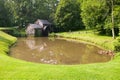 Historic Edwin B. Mabry Grist Mill (Mabry Mill) in rural Virginia on Blue Ridge Parkway and reflection on pond in summer