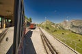 Historic electric train of the Schynige Platte Bahn SPB rack railway close to the summit station in the Bernese Alps.