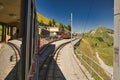 Historic electric train of the Schynige Platte Bahn SPB rack railway close to the summit station in the Bernese Alps.