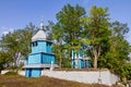 Historic entrance to churchyard of Assumption of the Holy Mother of God russian Orthodox church, wooden temple from the street Royalty Free Stock Photo