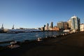 Iconic skyline of traditional Downtown Ferry Terminal and high-risers on urban shore at sunrise in Auckland CBD, New Zealand 