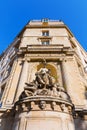 Historic fountain at a building in Paris, France Royalty Free Stock Photo