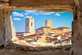 Historic French riviera old town of Antibes seafront and rooftops view through stone window Royalty Free Stock Photo