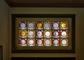 Historic German glass coins on a window