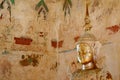 Historic Gilded Buddha Image with Aged Mural of the Old Vihara of Wat Chomphuwek Buddhist Temple, Thailand