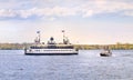 Historic Grandfather Toronto Ferry boat and a small water taxi boat moving in dark blue waters of Inner Harbour of Lake Royalty Free Stock Photo