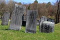 Historic gravestones in grass and hilly landscape, The Revolutionary Cemetery, Salem, New York, 2016