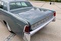 Historic gray vintage Lincoln Continental car parked in a parking lot