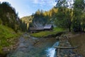 A historic grist mill building on the banks of Creek in Carpathian mountains, Slovakia, Europe. Old mill powered by water Royalty Free Stock Photo