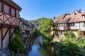 Historic half-timbered houses on the Weiss River in the village center of Kaysersberg Royalty Free Stock Photo