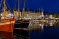 Historic harbor Honfleur with sailing ships in the evening, France