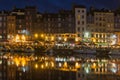 Historic harbor Honfleur with sailing ships in the evening, France