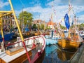 Decorated boats in historic harbour during event Admiralty Days in old town of Dokkum, Friesland, Netherlands Royalty Free Stock Photo