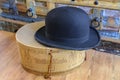 A historic hatbox from Berlin in the 19th century with a bowler on an old wooden table