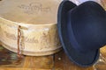 A historic hatbox from Berlin in the 19th century with a bowler on an old wooden table