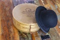 A historic hatbox from Berlin in the 19th century with a bowler on an old wooden table