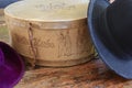 A historic hatbox from Berlin in the 19th century with two old hats on an old wooden table