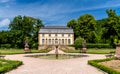 Historic high school Lyceum building and gardens with fountain and statues in Echternach