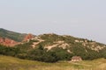 The historic home of Henry Persse nestled among dramatic red sandstone rock formations and prairie grasses Royalty Free Stock Photo