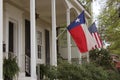 Historic Home With Texas and American Flags Royalty Free Stock Photo