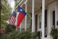 Historic Home With Texas and American Flags Royalty Free Stock Photo